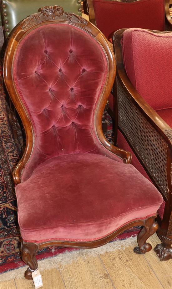 A Victorian walnut spoonback nursing chair